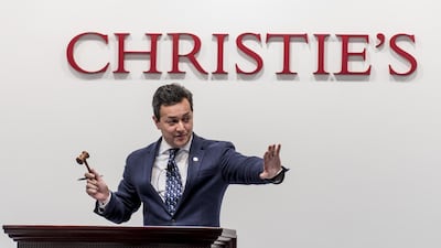 Christie's auctioneer Rahul Kadakia takes bids at the auction of the Pink Promise in Hong Kong. Keith Tsuji/Getty