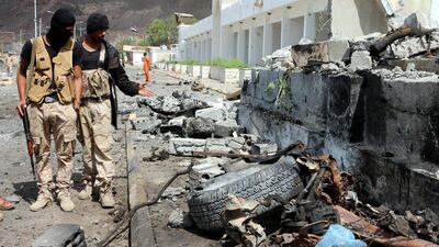 Yemeni soldiers inspect the site of car bomb attacks outside the headquarters of a counter-terrorism unit in the southern port city of Aden, Yemen, last month. EPA