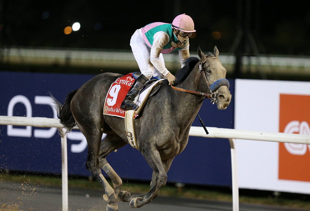 Mike Smith rides Arrogate to victory in the main event of the 2017 Dubai World Cup. Pawan Singh / The National file