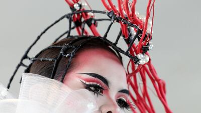 A model poses for photographs at the Dubai World Cup. Chris Whiteoak / The National