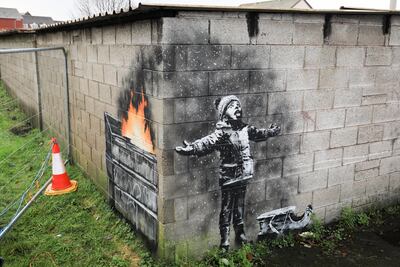 'Season's Greetings', the latest artwork by guerrilla artist Banksy. Credit: Matt Cardy/Getty Images