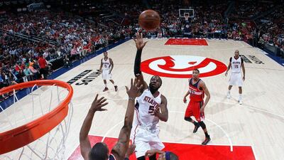 DeMarre Carroll of the Atlanta Hawks lifts a shot during his team's Game 2 win in the NBA play-offs second round against the Washington Wizards on Tuesday night. Kevin C Cox / Getty Images / AFP / May 5, 2015