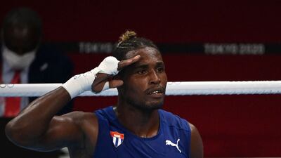 Cuba's Julio La Cruz celebrates after winning against ROC's Muslim Gadzhimagomedov in the men's heavyweight boxing final bout.