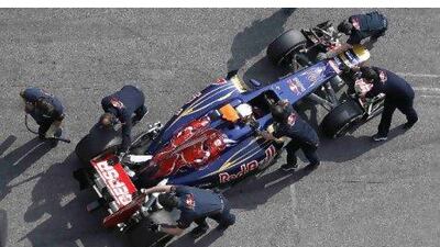 Toro Rosso mechanics push Daniel Ricciardo back into the pit garage during testing. He and teammate Jean-Eric Vergne are expected to get the team seventh in the constructors’ championship this year.