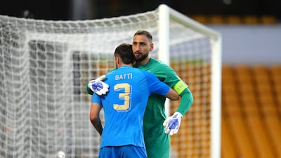 Italy's Federico Gatti hugs team-mate Gianluigi Donnarumma. PA