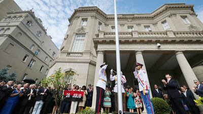 Cuban foreign minister Bruno Rodriguez, second right, applauds as the Cuban flag is raised in front of the country's embassy for the first time in 54 years on July 20, 2015 in Washington, DC. Chip Somodevilla/Getty Images/AFP