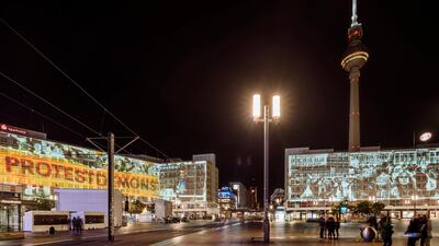 3D projections of the Berlin Wall are being displayed on buildings in Berlin. Alexander Rentsch