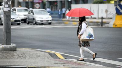 Light rain falls over Abu Dhabi on Sunday. Khushnum Bhandari for The National