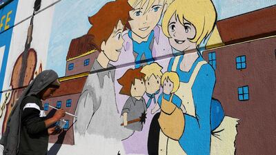 An Iraqi demonstrator paints a mural during ongoing anti-government protests, in Baghdad. Reuters