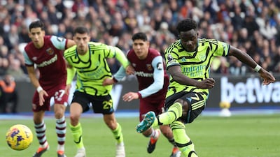 Bukayo Saka scores Arsenal's second goal from the penalty spot. AFP