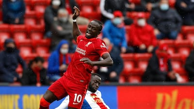 Liverpool's Sadio Mane goes down after a challenge by Cheikhou Kouyate of Palace. PA