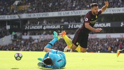 Manchester City's Sergio Aguero dives over Tottenham goalkepeer Hugo Lloris during the English Premier League football match on October 2, 2016. Ian Kington / AFP