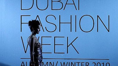 A model wears a dress designed by Aly Fawaz.