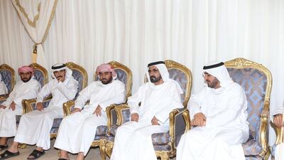Sheikh Mohammed bin Rashid with the family of a fallen Emirati soldier. Wam