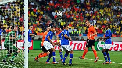 Wesley Sneijder, second right, heads home the Dutch winner on 68 minutes to dump Brazil out of the World Cup.