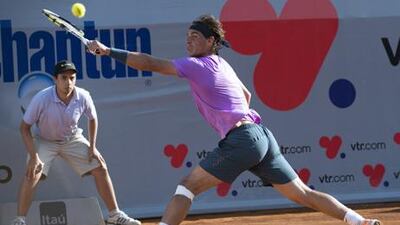 Rafael Nadal returns the ball to Federico Delbonis in his first singles match since Wimbledon 2012.