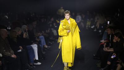 A pop of yellow as an oversized trench coat. Bloomberg