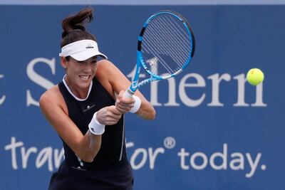 Garbine Muguruza, of Spain, returns to Madison Keys during the round of 16 at the Western & Southern Open tennis tournament. John Minchillo / AP Photo