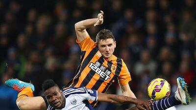 Alex Bruce of Hull City jumps with Brown Ideye of West Bromwich Albion during their Premier League match, which West Brom won 1-0, on Saturday at The Hawthorns. Clive Mason / Getty Images