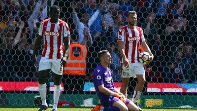 Stoke City goalkeeper Jack Butland, centre, reacts after Crystal Palace's Patrick van Aanholt scores his side's second goal at bet365 Stadium in a 2-1 win for Palace. The defeat saw Stoke relegated from the Premier League. Dave Thompson / PA