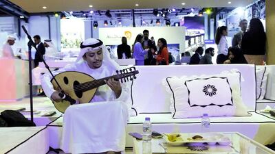 An oud player at the Arabian Travel Market in Dubai on Monday. The city aims to draw 20 million visitors in 2020. Christopher Pike / The National