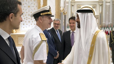 Sheikh Mohamed bin Zayed greets an Italian delegation member during a reception held at the Presidential Palace. Hamad Al Kaabi / Ministry of Presidential Affairs. Hamad Al Kaabi / Ministry of Presidential Affairs