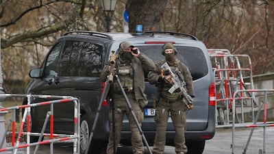 Police stand guard outside Bellevue Palace during Mr Al Shara's visit. Getty Images