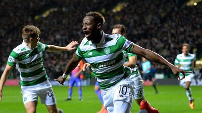 Moussa Dembele of Celtic celebrates after scoring the opening goal against Manchester City in the Champions League. Mark Runnacles / Getty Images