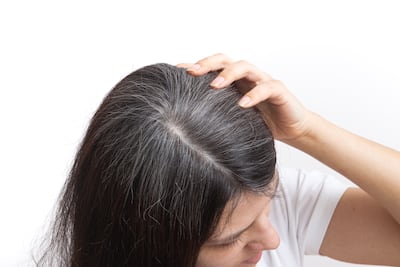 Plucking greys can weaken the hair follicle, so is best avoided. Getty Images