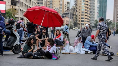 Protesters erected tents, set out chairs and sit on the ground as they blocked the main highway leading to east Beirut. EPA