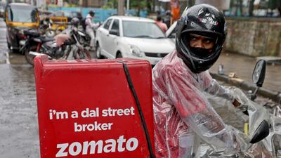 A Zomato delivery worker prepares to pick up an order from a restaurant in Mumbai, India. Reuters