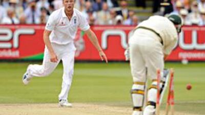 Andrew Flintoff bowls Peter Siddle, one of his five victims in Australia's second innings.