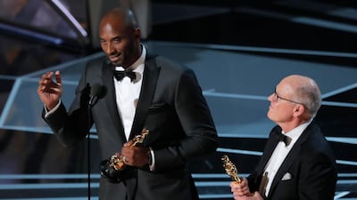 Bryant and Glen Keane accept the Oscar for Best Animated Short Film for 'Dear Basketball'. Reuters
