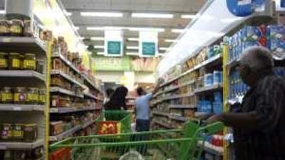 Shoppers at an Abu Dhabi Co-operative stock up on supplies before iftar yesterday.