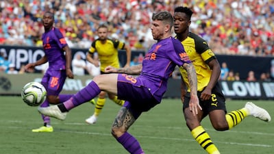Liverpool's Alberto Moreno tries to drive past Borussia Dortmund's Dan-Axel Zagadou. AP Photo