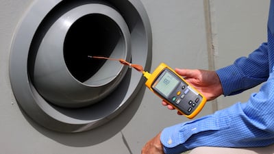 A digital thermometer measures the temperature at the Al Janoub Stadium in Doha.