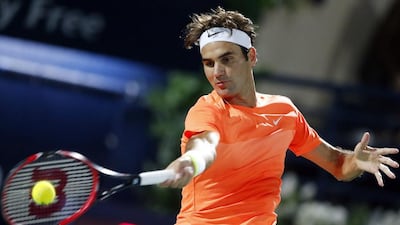 Roger Federer plays a shot on Monday against Mikhail Youzhny in the first round of the ATP Dubai Duty Free Tennis Championships. Ahmed Jadallah / Reuters
