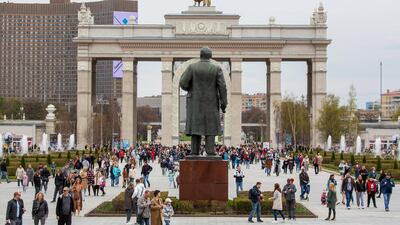 Visitors walk by a statue of Vladimir Lenin, founder of the Soviet Union, in Moscow, Russia. Tourism revenues will remain subdued in 2021.Bloomberg