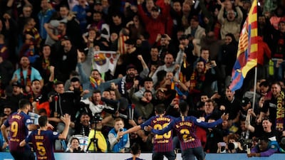 Lionel Messi celebrates scoring their third goal. Joan Monfort / AP Photo