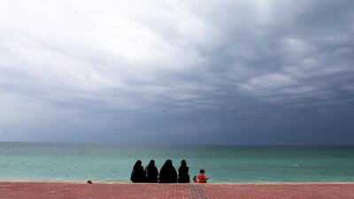 People enjoying the cloudy weather at the public beach at Umm Al Quwain on Wednesday. Pawan Singh / The National