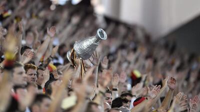 Germany supporters hold up a makeshift trophy on the stands. Martin Meissner / AP Photo