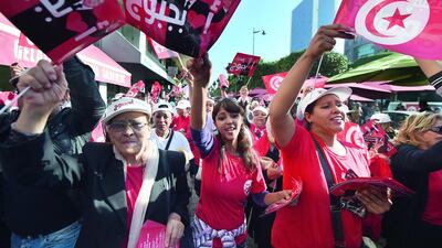 Supporters of Tunisian presidential candidate Beji Caid Essebsi shout slogans and wave flags during an election campaign in the capital, Tunis, on November 21. Fadel Senna / AFP Photo