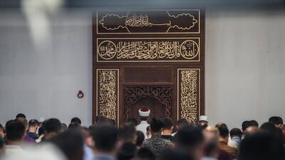 epa08576317 Muslims wearing face mask gather and pray in a Turkish mosque to pray and mark the Muslim religious holiday of Eid aL-Adha, at the northern suburbs of Paris, France , 31 July 2020. Eid al-Adha is the holiest of the two Muslims holidays celebrated each year, it marks the yearly Muslim pilgrimage (Hajj) to visit Mecca, the holiest place in Islam. Muslims slaughter a sacrificial animal and split the meat into three parts, one for the family, one for friends and relatives, and one for the poor and needy. EPA/Mohammed Badra