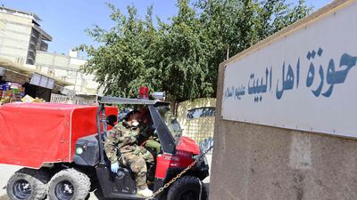 Members of the Iraqi civil defence arrive to disinfect a religious school which attracts predominantly foreign students and where the first Iraqi case of novel coronavirus infection was confirmed, in the central shrine city of Najaf. AFP