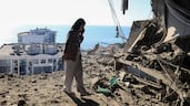 A woman stands in the shell an apartment after the building was hit in a Russian drone strike, in Odesa, Ukraine. Reuters