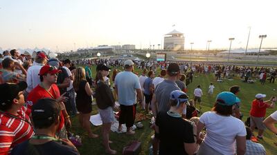 People watching the Formula One Etihad Airways Abu Dhabi Grand Prix from Abu Dhabi Hill at Yas Marina Circuit in Abu Dhabi. Pawan Singh / The National