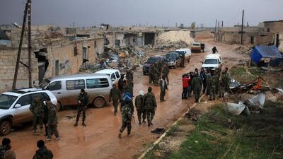 Syrian soldiers re-group after taking control of the village of Ratian, north of the embattled city of Aleppo, from rebel fighters on February 6, 2016. George Ourfalian/AFP