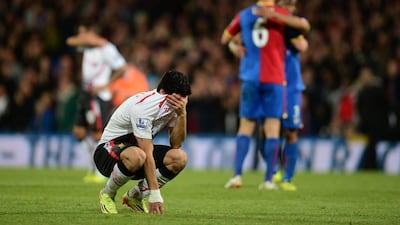 Luis Suarez reacts after his Liverpool's 3-3 draw against Crystal Palace on May 5. Jamie McDonald / Getty Images