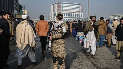 A Taliban fighter stands guard in Kabul. AFP