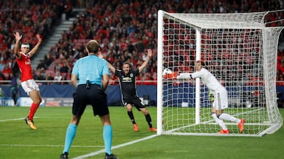 Benfica goalkeeper Mile Svilar carries the ball over the line as Manchester United's Marcus Rashford (not pictured) scored the only goal. Carl Recine / Reuters